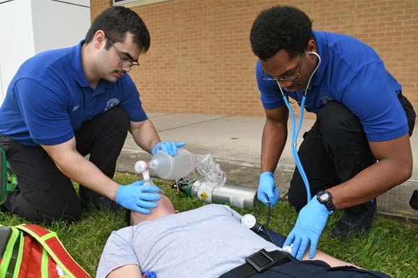 EMS Students giving emergency care to patient