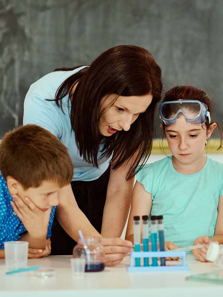 Teacher working with students