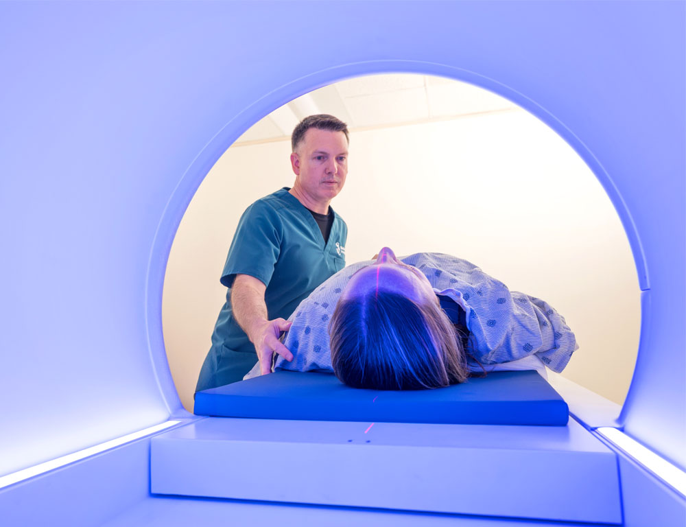 Imaging tech assisting patient