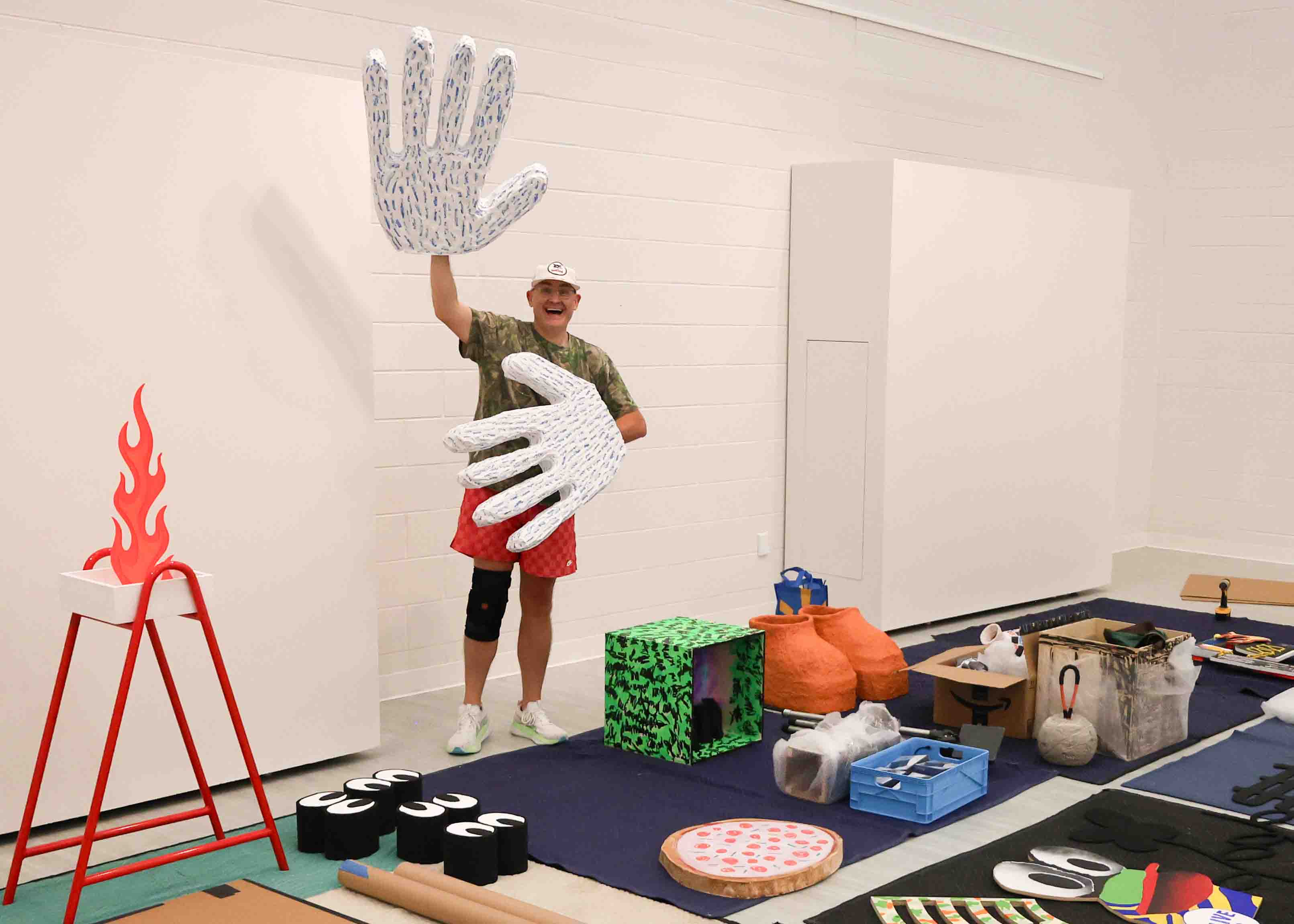Artist Justin Plakas at the installation of "Camaro Lucinda".